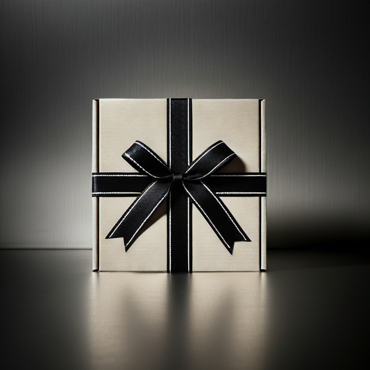 Gift box with a black ribbon on a dark background