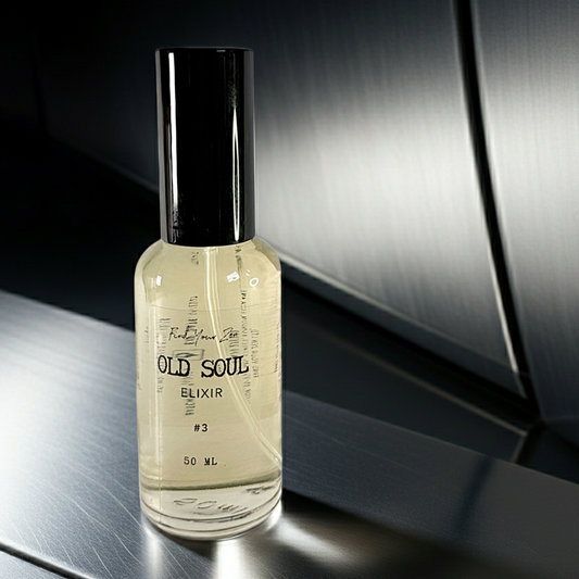 Bottle of 'Old Soul Elixir #3' on a reflective surface